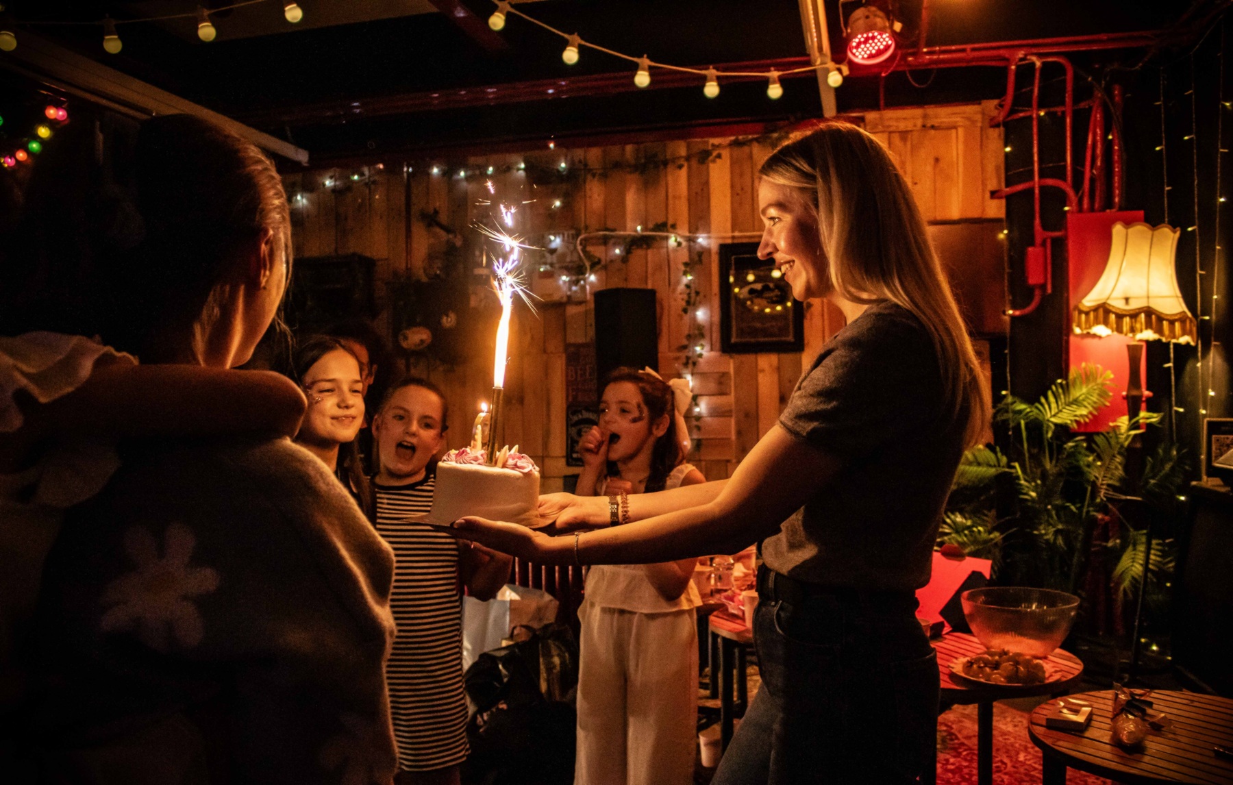 Studio birthday cake celebration with sparklers
